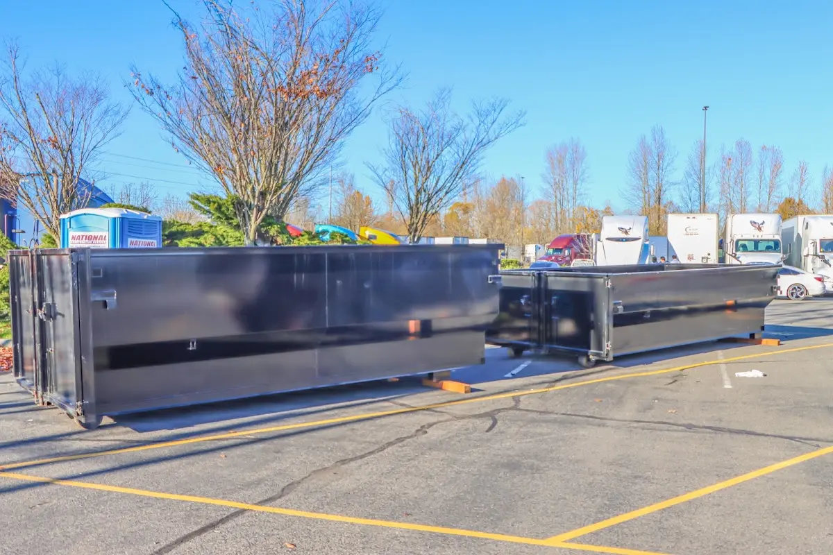 Professional dumpster rental service with roll-off container on residential driveway in Fleming Island